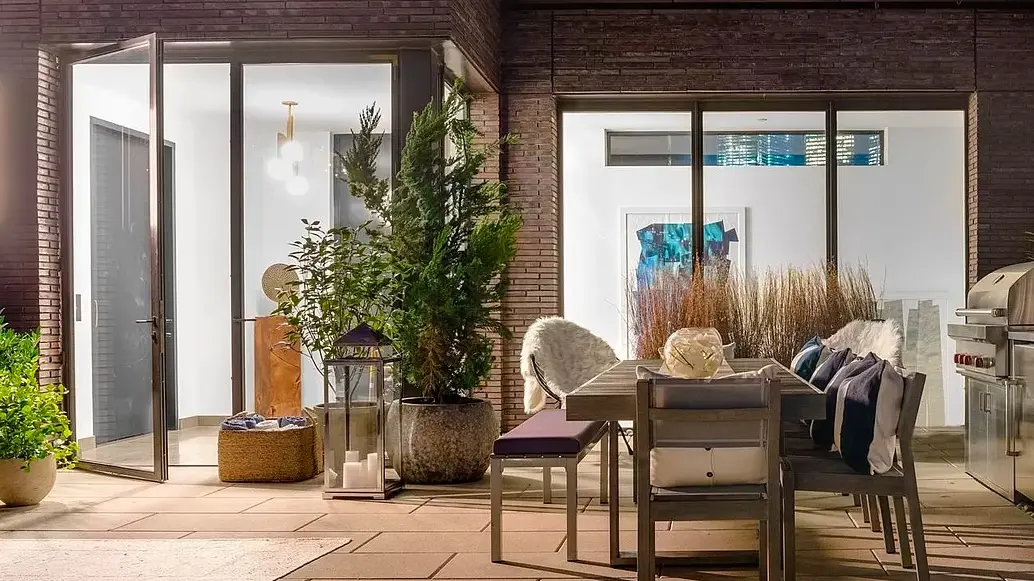 Thermal Bronze French swing door pair and Fixed window wall with patina finish, low profile threshold, high performance low iron insulating glass