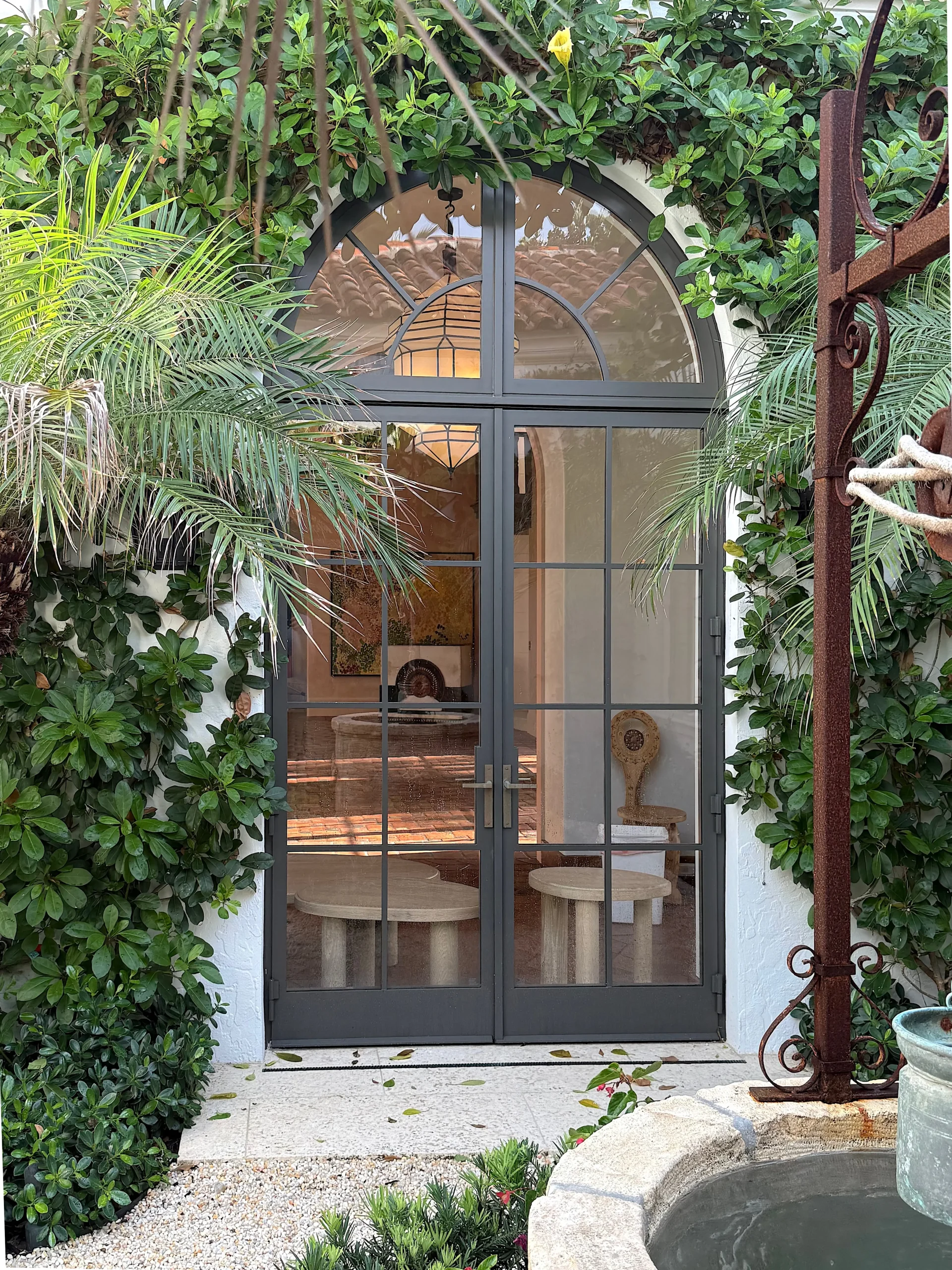 Thermal Stainless Stee l Impact French door pair with arched transom, powder coat finish, SDL muntins, hurricane rated glazing