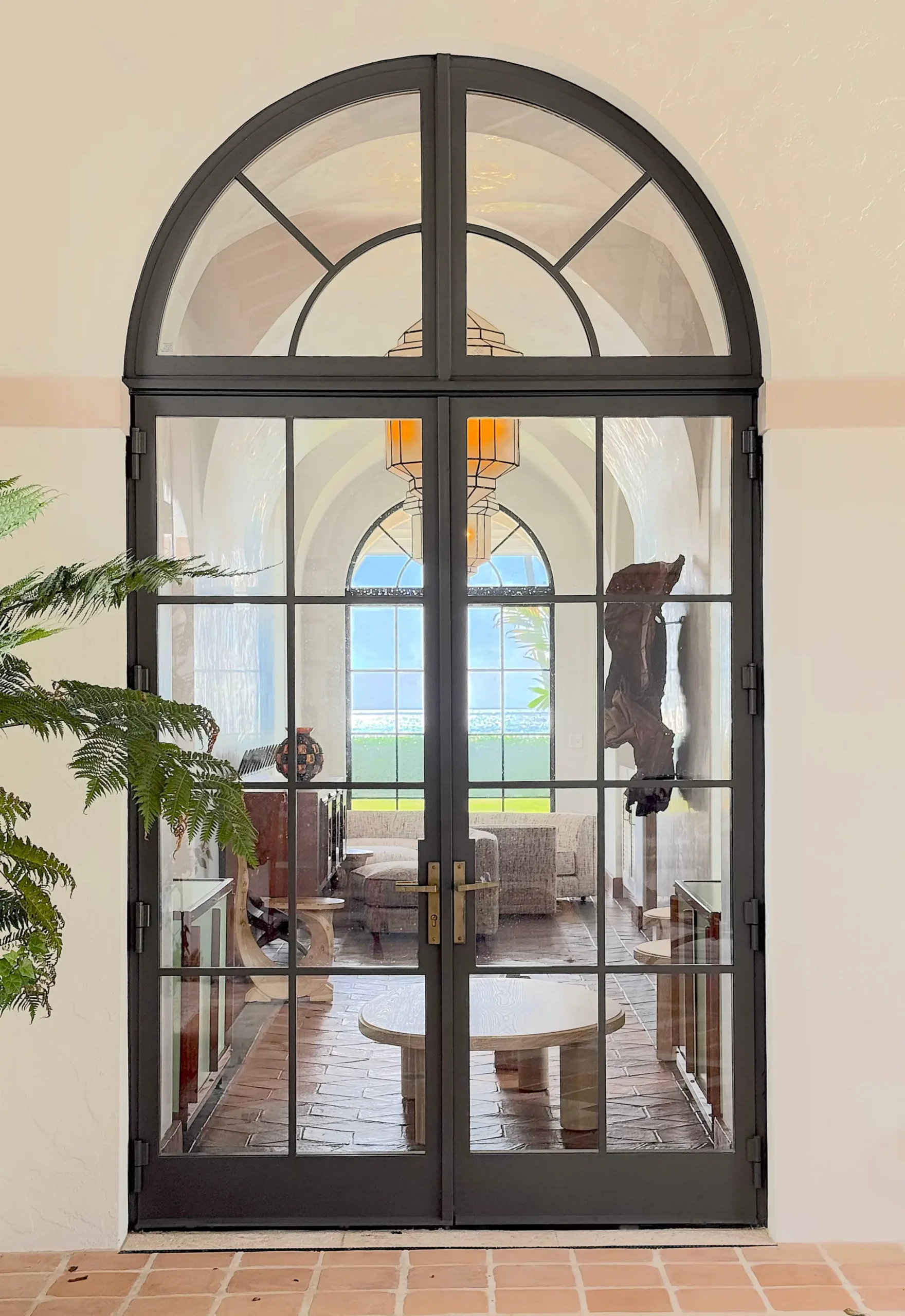 Thermal Stainless Steel Impact French door pair with arched transom, powder coat finish, SDL muntins, hurricane rated glazing